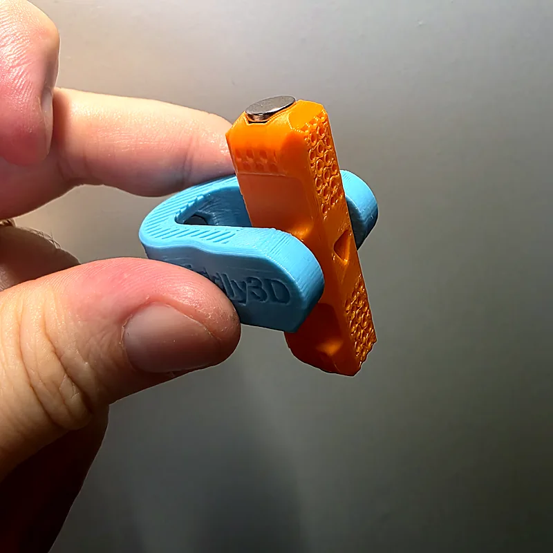 Rotor standing upright, showing the printed surface and the magnet in its tip